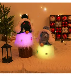 Close-up of two glowing Christmas gnomes with warm LED beards and festive knitted hats