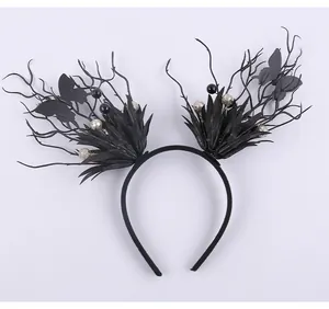 Detailed view of black gothic Halloween headband with branches and butterflies.