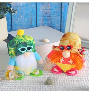 Close-up of two cute beach-themed gnome dolls with sunglasses and summer attire.