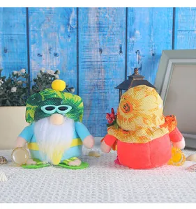 Detailed view of cute summer beach gnomes with tropical hats, sunglasses and seashells