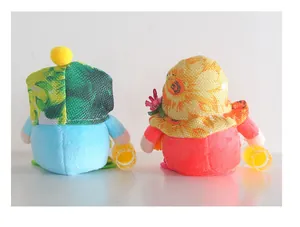 Back view of two cute summer beach-themed gnomes plush dolls with colorful hats