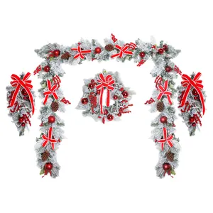 Set de corona y guirnalda de Navidad nevada con lazos rojos y bolas
