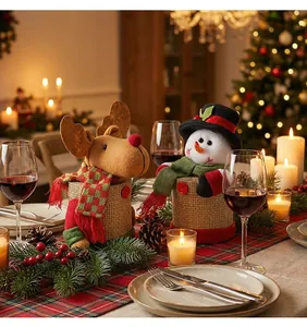 Decorative Christmas reindeer and snowman candy jars on a festive holiday dinner table
