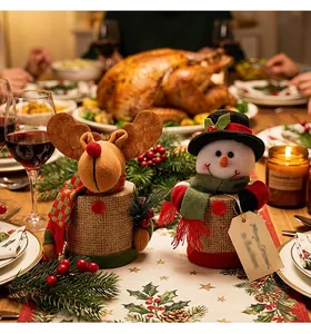 Festive Christmas candy jars featuring snowman and reindeer characters on a holiday dinner table.