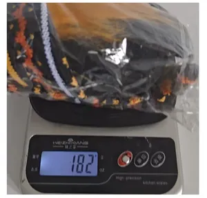 Macro view showing the 182g weight of the Halloween green beard gnome plush toy