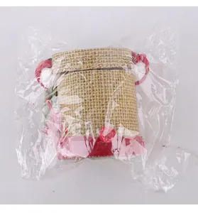 Handmade burlap Christmas gift candy jar detail showing clear plastic packaging