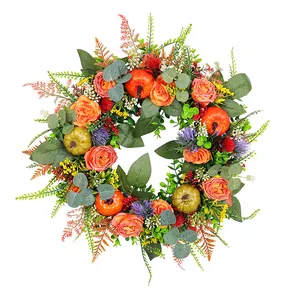 Artificial fall wreath with orange pumpkins and roses for Thanksgiving door decor