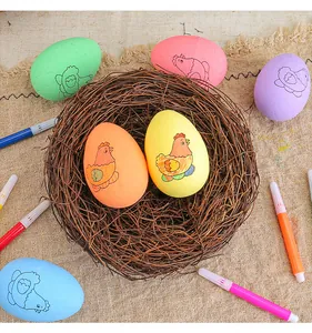 Detailed close-up of colorful DIY foam Easter eggs and markers in a rustic bird nest