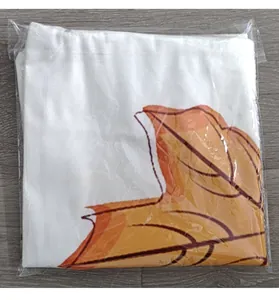 Detail shot of a folded fall harvest maple leaf decorative pillowcase in plastic packaging.