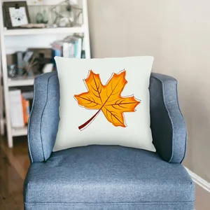 Autumn maple leaf decorative pillowcase cover on a blue sofa chair in cozy living room