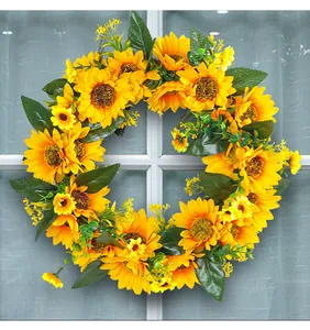 Couronne de tournesols artificiels vibrants avec feuilles vertes pour décoration printanière.