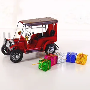 Vintage red metal car model with colorful laser gift box ornaments for Christmas