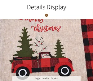 Detail of Christmas placemat featuring embroidered buffalo plaid truck on burlap fabric