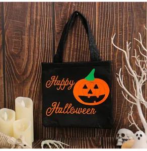 Black Halloween candy tote bag featuring a pumpkin and Happy Halloween text detail