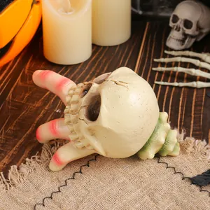 Τρομακτικό κρανίο από ρητίνη Halloween με σκελετικό χέρι και διακόσμηση κοχυλιού