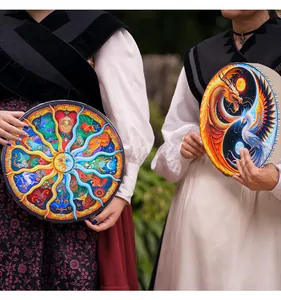 Dos tambores chamánicos con signos del zodiaco y diseños de dragón y fénix