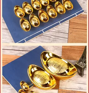 Detailed macro shot of traditional Chinese golden ingots with embossed wealth symbols