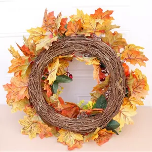 Autumn Thanksgiving wreath with maple leaves, pumpkins and pinecones for door decor