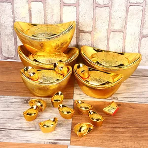 Traditional golden Chinese New Year Yuan Bao sycee ingots for wealth and prosperity decoration