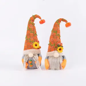 Pair of autumn harvest gnomes with sunflowers and pumpkins for Thanksgiving decor