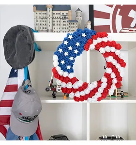 Patriotic American flag themed rose wreath displayed on a white shelf home decor