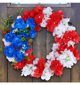 Close-up view of a patriotic red white and blue artificial flower wreath for Independence Day