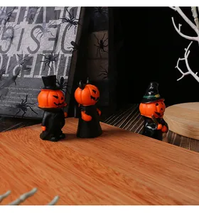 Detailed close-up of mini resin Halloween pumpkin devil and gentleman figurines set