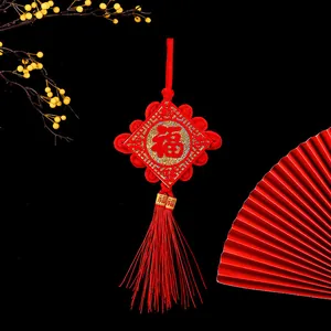 Traditional Chinese red knot hanging decoration with Fu character and long tassel detail
