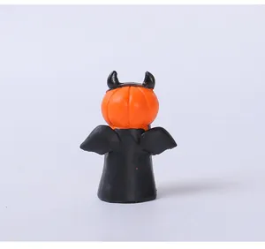 Detailed back view of a mini Halloween pumpkin devil resin figurine with bat wings