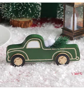 Detailed view of dark green wooden vintage truck Christmas ornament with pine decor