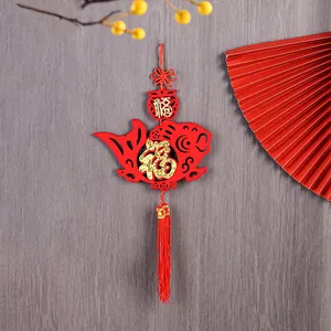 Traditional Chinese New Year hanging ornament with red fish design and golden Fu character