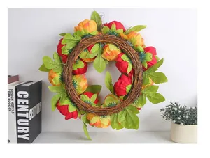 Vibrant red and yellow artificial peony wreath for wedding and home wall decoration.