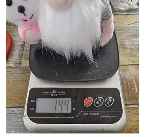 Macro view showing the weight measurement of an Easter gnome plush doll at 144 grams