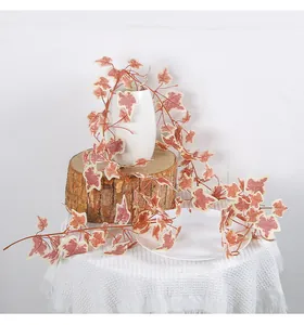 Close-up detail of artificial red sweet potato leaf vine for Thanksgiving home decor