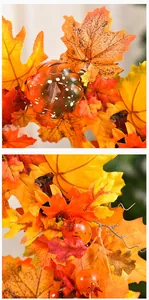 Macro view showing the realistic texture of artificial maple leaves and a small pumpkin