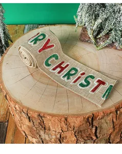 Detailed view of burlap Christmas ribbon with glittery 'Merry Christmas' text and wire edge