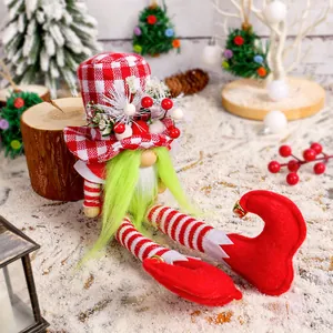 Festive Christmas gnome plush toy with long legs, green beard, and red checkered hat