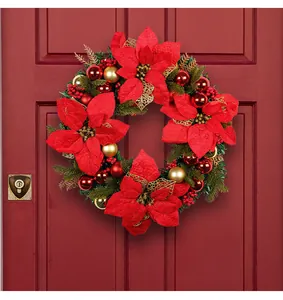 Exquisite large red Christmas wreath featuring poinsettias and ornaments on a wooden door
