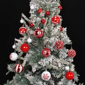 Festive red and white Christmas ball ornament set with painted snowflakes for tree decoration
