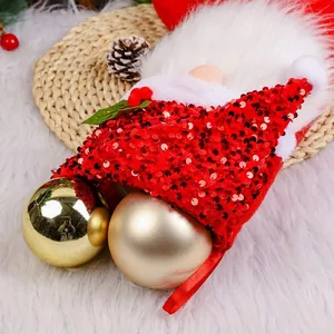 Festive red sequin gnome Christmas stocking gift bag with white fuzzy beard detail