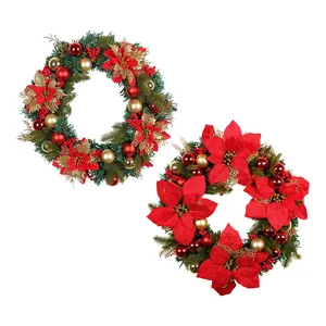 Large Christmas wreath with red poinsettias and gold ornaments for festive holiday decoration