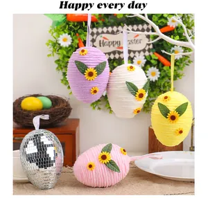 Set of colorful knitted Easter egg hanging ornaments with sunflower decor for party
