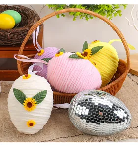 Detailed view of colorful plush Easter egg ornaments with sunflower decor and mirror disco egg.