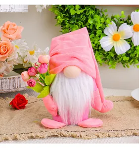 Detailed view of a pink Mother's Day plush gnome holding a colorful tulip bouquet decoration