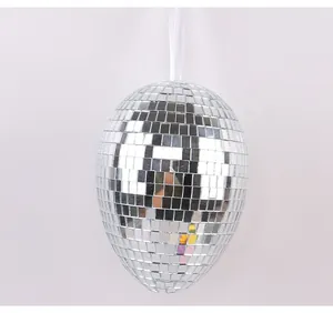 Detailed view of silver mirror disco Easter egg ornament hanging with white ribbon