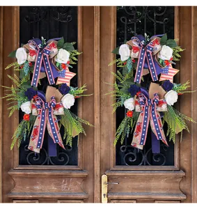 American Independence Day patriotic wreath with roses hanging on a classic wooden door