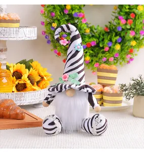 Detailed view of plush zebra-patterned gnome doll in festive setting
