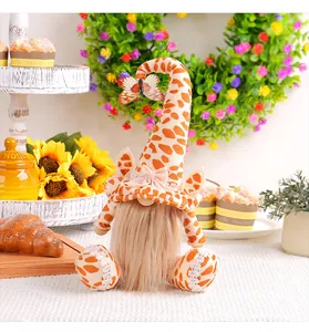 Charming handmade giraffe print gnome doll featuring a long beard and butterfly accent detail