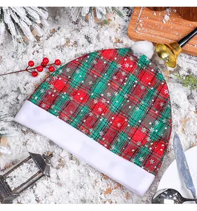 Detailed view of red and green plaid Christmas car seat cover with snowflake prints