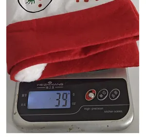 Detail view of Christmas car seat headrest cover showing weight of 39g on digital scale